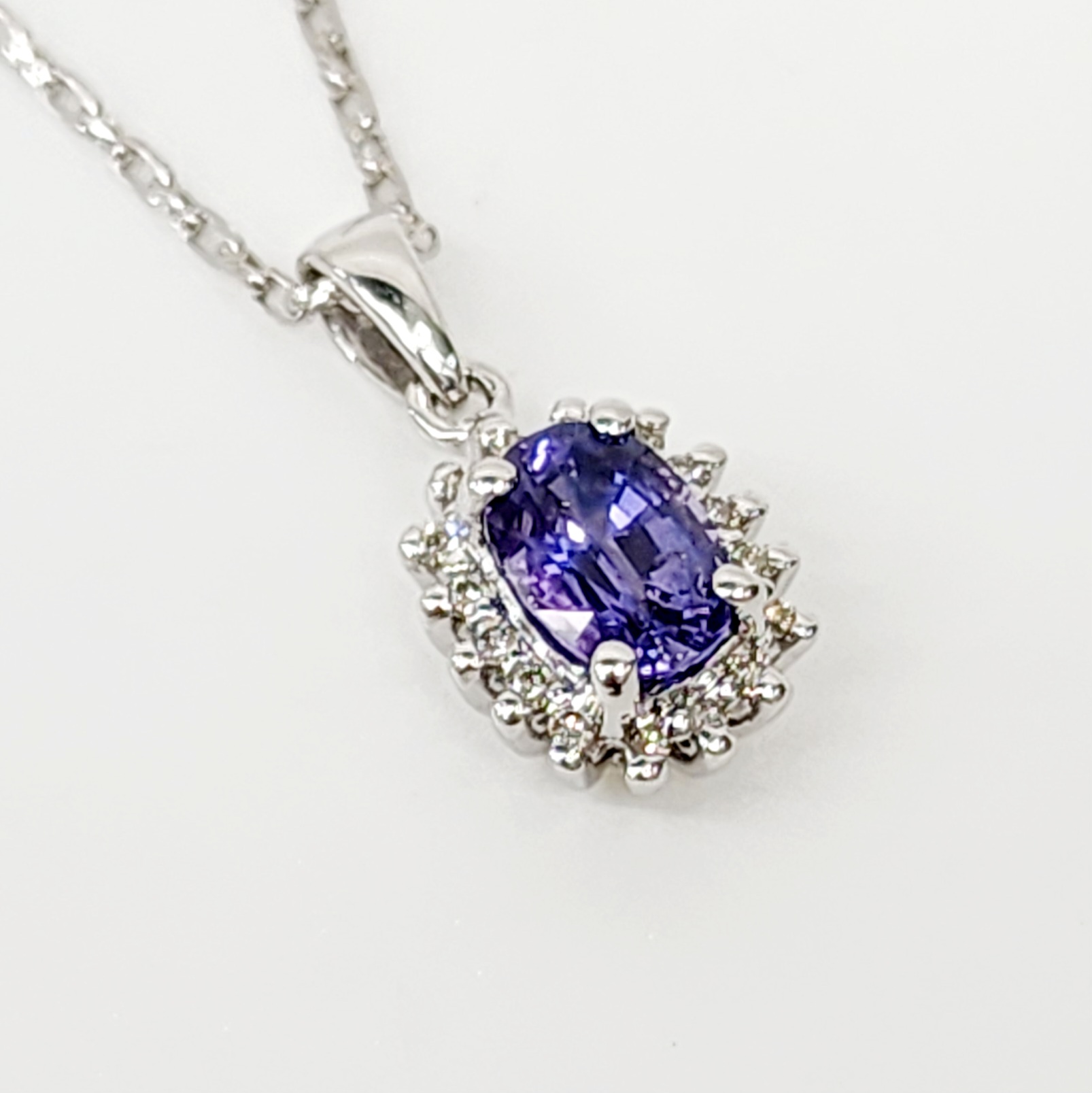 9ct White Gold 1.06ct Ceylon Sapphire with 0.10ct Diamond Halo Pendant Gold Pendants 